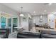 Open-concept kitchen with granite countertops, stainless steel appliances, and a breakfast nook at 7351 Spring Mountain Ln, Yalaha, FL 34797