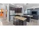 Kitchen with granite countertops, stainless steel appliances, and a central island at 7351 Spring Mountain Ln, Yalaha, FL 34797