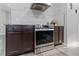 Modern kitchen with stainless steel appliances, granite countertops, and custom cabinetry at 7351 Spring Mountain Ln, Yalaha, FL 34797