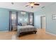 Relaxing bedroom featuring neutral walls, and a comfortable bed with stylish bedding at 7351 Spring Mountain Ln, Yalaha, FL 34797
