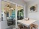Cozy patio and outdoor kitchen with stylish seating and a seamless transition to the interior at 7351 Spring Mountain Ln, Yalaha, FL 34797