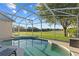 The refreshing pool is a peaceful retreat, complemented by a serene view of the surrounding landscape at 7351 Spring Mountain Ln, Yalaha, FL 34797