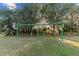 Community swing set, providing an outdoor recreation area for residents and families at 7351 Spring Mountain Ln, Yalaha, FL 34797