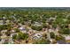 Aerial view of home featuring a private pool and a lush, green neighborhood, close to local parks at 8444 Sandberry Blvd, Orlando, FL 32819