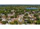 Overhead image displaying a home with a backyard pool nestled in a tree-filled neighborhood at 8444 Sandberry Blvd, Orlando, FL 32819