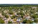 Captivating aerial view of property highlighting the backyard pool and surrounding neighborhood at 8444 Sandberry Blvd, Orlando, FL 32819