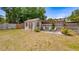 The backyard features a shed and trellis, offering charm and functionality at 8444 Sandberry Blvd, Orlando, FL 32819