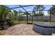 The backyard with a brick patio and above-ground pool offers outdoor enjoyment at 8444 Sandberry Blvd, Orlando, FL 32819