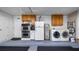Inside the garage there is a laundry area, refrigerator, and plenty of storage space at 8444 Sandberry Blvd, Orlando, FL 32819