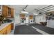 The garage offers laundry, a refrigerator, and additional space with upper cabinets for storing belongings at 8444 Sandberry Blvd, Orlando, FL 32819