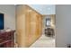 Hallway with built in storage and decorative table with mirror for added character to the home at 8444 Sandberry Blvd, Orlando, FL 32819