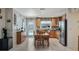 Kitchen features wooden cabinets and leads to views of the pool, providing a functional and appealing design at 8444 Sandberry Blvd, Orlando, FL 32819