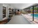 View of the lanai with outdoor furniture and access to the in-ground pool at 8444 Sandberry Blvd, Orlando, FL 32819