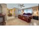 Main bedroom featuring a cozy bed, neutral paint colors, and tile flooring at 8444 Sandberry Blvd, Orlando, FL 32819