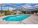 Beautiful screened pool and patio area, with tranquil backyard views at 8444 Sandberry Blvd, Orlando, FL 32819