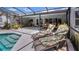 Inviting pool deck with lounge chairs and access to indoor/outdoor living at 8444 Sandberry Blvd, Orlando, FL 32819