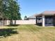 Spacious backyard with a well-maintained lawn, fenced in yard, and a screened patio at 865 Bay Bridge Cir, Apopka, FL 32703