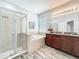 Lovely bathroom features a large soaking tub, a stand-up shower, and dual sinks at 865 Bay Bridge Cir, Apopka, FL 32703
