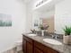 Bathroom features a dual sink vanity with granite counter at 865 Bay Bridge Cir, Apopka, FL 32703