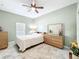 Bedroom featuring neutral paint, natural light, ceiling fan and tile floors at 865 Bay Bridge Cir, Apopka, FL 32703