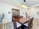 Dining room features a dark wood table set, chandelier, and china cabinet at 865 Bay Bridge Cir, Apopka, FL 32703