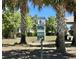 Dog waste station in a grassy, shaded area, perfect for pet owners in the community at 865 Bay Bridge Cir, Apopka, FL 32703
