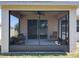 Relaxing enclosed patio with comfortable seating, ceiling fan, and view to the yard at 865 Bay Bridge Cir, Apopka, FL 32703