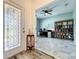 Inviting entryway with decorative door and view into the home office at 865 Bay Bridge Cir, Apopka, FL 32703