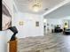 Hallway featuring modern lighting, artwork, and view into the living space at 865 Bay Bridge Cir, Apopka, FL 32703