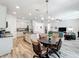 Open concept kitchen, dining area, and living room filled with natural light at 865 Bay Bridge Cir, Apopka, FL 32703
