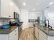 Bright kitchen featuring stainless steel appliances, granite countertops, and decorative backsplash at 865 Bay Bridge Cir, Apopka, FL 32703