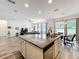 Kitchen island boasts a granite countertop, stainless steel appliances and open to the living room at 865 Bay Bridge Cir, Apopka, FL 32703