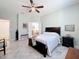 Spacious main bedroom with ensuite bath, ceiling fan, and access to the bathroom at 865 Bay Bridge Cir, Apopka, FL 32703