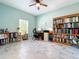 Home office with built-in bookshelves and natural light at 865 Bay Bridge Cir, Apopka, FL 32703
