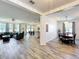 Open concept living with living, dining, and kitchen area showcasing wood-look tile flooring at 865 Bay Bridge Cir, Apopka, FL 32703