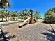 Community playground area with a slide and climbing structure, perfect for children to enjoy at 865 Bay Bridge Cir, Apopka, FL 32703