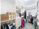 Large walk-in closet features extensive shelving and hanging storage and bright overhead lighting at 865 Bay Bridge Cir, Apopka, FL 32703