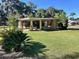 Inviting single story home with a spacious, well-manicured lawn and mature landscaping at 951 Cr 453, Lake Panasoffkee, FL 33538