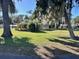 Well-maintained single story home with an expansive lawn and shade trees at 951 Cr 453, Lake Panasoffkee, FL 33538