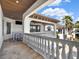 Large balcony with a covered bar area and stone balustrade offers great views at 971 Golden Bear Dr, Reunion, FL 34747