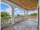 Inviting balcony with stone balustrade offers a relaxing outdoor space with neighborhood views at 971 Golden Bear Dr, Reunion, FL 34747