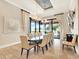 Dining area with a large table, seating for ten, and sliding glass doors with an outdoor view at 971 Golden Bear Dr, Reunion, FL 34747