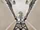 Spacious foyer with a double staircase, decorative lighting, and views into the home at 971 Golden Bear Dr, Reunion, FL 34747