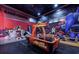 This game room features air hockey and a Looney Toons mural at 971 Golden Bear Dr, Reunion, FL 34747