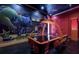 Fun game room featuring a mural of Looney Toons and an air hockey table at 971 Golden Bear Dr, Reunion, FL 34747