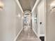 Elegant hallway featuring stone floors, high ceilings, and decorative lighting fixtures at 971 Golden Bear Dr, Reunion, FL 34747