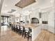 Gourmet kitchen featuring custom cabinetry, a large island with seating, and modern appliances at 971 Golden Bear Dr, Reunion, FL 34747
