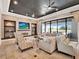 Inviting living area with stone accent wall, built-in shelves, large TV, and backyard views at 971 Golden Bear Dr, Reunion, FL 34747
