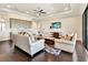 Living room with hardwood floors, and wet bar at 971 Golden Bear Dr, Reunion, FL 34747