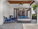 Relaxing outdoor lounge area with a daybed and seating, offering a serene escape at 971 Golden Bear Dr, Reunion, FL 34747